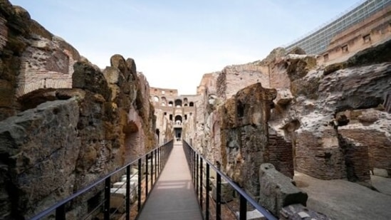 In the presence of the founder of Tod’s, the shoe-and-luxury-goods maker, who has footed the bill, Italy’s culture minister on Friday formally announced the completion of work to shore-up and restore the ancient arena’s “backstage.”((AP Photo/Andrew Medichini))