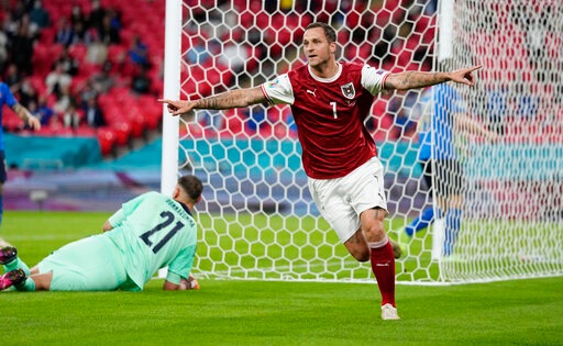 Austria's Marko Arnautovic, celebrates after scoring a VAR deleted goal during the Euro 2020 soccer championship round of 16 match between Italy and Austria at Wembley stadium in London, Saturday, June 26, 2021. (AP Photo/Frank Augstein, Pool) Austria's Marko Arnautovic, celebrates after scoring a VAR deleted goal during the Euro 2020 soccer championship round of 16 match between Italy and Austria at Wembley stadium in London, Saturday, June 26, 2021. (AP Photo/Frank Augstein, Pool)