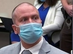 Former Minneapolis police officer Derek Chauvin reacts as he listens to the judge announce his sentence of 22.5 years in prison for the murder of George Floyd during his sentencing hearing in Minneapolis. 