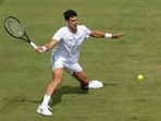 FILE PHOTO: Tennis - Wimbledon - All England Lawn Tennis and Croquet Club, London, Britain - June 25, 2021 Serbia's Novak Djokovic during a practice session Pool via REUTERS/Simon Bruty