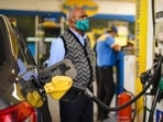 A man looks at the counter as his car is filled with fuel at a petrol pump in New Delhi.(Amal KS/HT File Photo) A man looks at the counter as his car is filled with fuel at a petrol pump in New Delhi.(Amal KS/HT File Photo)
