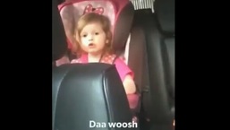 The image shows the little girl singing Bohemian Rhapsody by Queen.