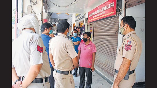 Police carrying out investigations outside the jewellery workshop in Sector 23 on Sunday. (HT PHOTO) Police carrying out investigations outside the jewellery workshop in Sector 23 on Sunday. (HT PHOTO)