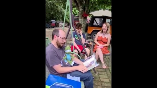 The video shows the kids surprising their stepdad. (Screenshot) The video shows the kids surprising their stepdad. (Screenshot)