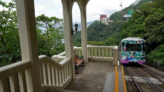 A Peak Tram passes an uphill of the Victoria Peak in Hong Kong on June 17, 2021. (AP)