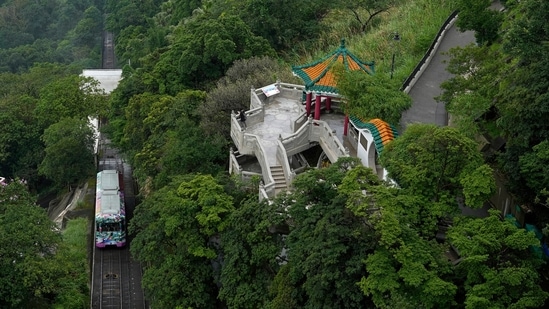 A Peak Tram passes uphill of the Victoria Peak in Hong Kong on June 17, 2021. (AP)