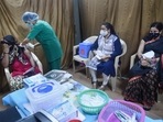 A healthcare worker administers a dose of Covid-19 vaccine to a sex worker, at Wadia hospital in Mumbai on Monday.