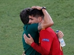 Spain coach Luis Enrique and Alvaro Morata (right) embrace during Euro 2020 clash against Poland. 