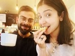 Anushka Sharma and Virat Kohli pose together.