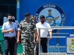Indian paramilitary officials come out of the Jammu air force station after two suspected blasts were reported early morning in Jammu.(AP Photo) Indian paramilitary officials come out of the Jammu air force station after two suspected blasts were reported early morning in Jammu.(AP Photo)