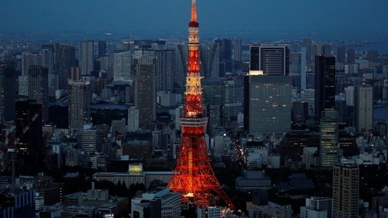 A view of the illuminated Tokyo Tower, pictured from the Sky Deck of Roppongi Hills in Tokyo,on June 2. The Tokyo Tower and other landmarks were lit in special Olympic colours in April to mark 100 days before the Summer Games opened.(Kim Kyung-Hoon / REUTERS)