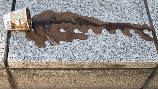 An abandoned and melting pint of ice cream dries along a city street on June 27 in Portland, Oregon. The heat has been blamed on a high-pressure ridge trapping warm air in the region. The NWS previously said it would "likely be one of the most extreme and prolonged heat waves in the recorded history of the Inland Northwest."(Nathan Howard / Getty Images / AFP)