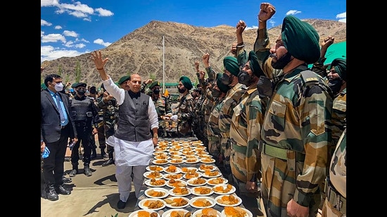 Defence minister Rajnath Singh interacts with soldiers on the second day of his visit to Karu in Ladakh. During the visit, Singh also dedicated to the nation 63 bridges built by the BRO. (PTI)