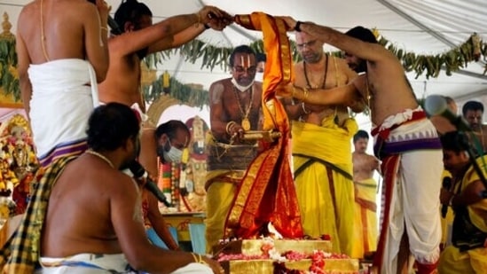 Sri Venkateswara Temple head priest Samudrala Venkatacharyulu, center, leads the Maha Kumbhabhishekam rituals on the fifth and final day of the Hindu rededication ceremony in Penn Hills, Pa., Sunday, June 27, 2021. (AP) Sri Venkateswara Temple head priest Samudrala Venkatacharyulu, center, leads the Maha Kumbhabhishekam rituals on the fifth and final day of the Hindu rededication ceremony in Penn Hills, Pa., Sunday, June 27, 2021. (AP)