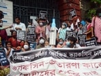 People protest against the fake Covid-19 vaccination procedure in front of the Kolkata Municipal Corporation office at Esplanade, in Kolkata on Monday. (ANI Photo) People protest against the fake Covid-19 vaccination procedure in front of the Kolkata Municipal Corporation office at Esplanade, in Kolkata on Monday. (ANI Photo)