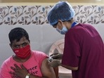 A resident gets inoculated against Covid-19 with a dose of the Covishield, in Mumbai on Tuesday.