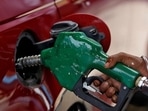 A worker holds a nozzle to pump petrol into a vehicle at a fuel station in Mumbai, India, on May 21, 2018. A worker holds a nozzle to pump petrol into a vehicle at a fuel station in Mumbai, India, on May 21, 2018.