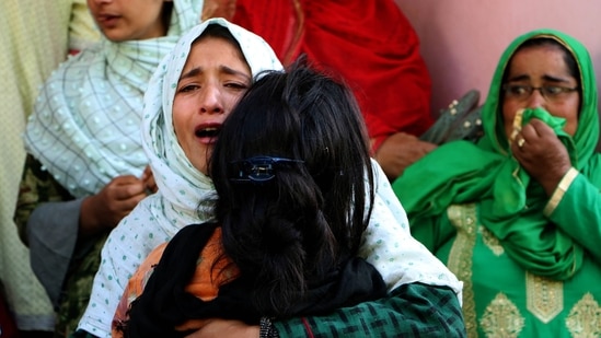 People mourn the death of SPO Fayaz Ahmad and his family after they were killed by terrorists at their home at Awantipora, in Pulwama on Monday. (ANI Photo) People mourn the death of SPO Fayaz Ahmad and his family after they were killed by terrorists at their home at Awantipora, in Pulwama on Monday. (ANI Photo)