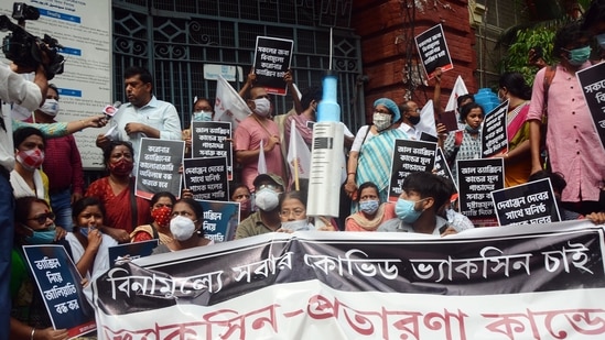 People protest against the fake Covid-19 vaccination procedure in front of the Kolkata Municipal Corporation office at Esplanade, in Kolkata on Monday. (ANI Photo) People protest against the fake Covid-19 vaccination procedure in front of the Kolkata Municipal Corporation office at Esplanade, in Kolkata on Monday. (ANI Photo)