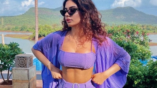 Khushi was spotted wearing a popping lavender coloured bikini with high waist bikini bottoms and a matching robe to complete her super chic look.(Instagram)