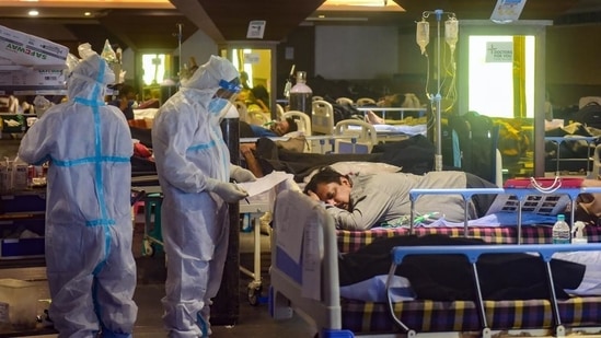 New Delhi: Health workers inspect Covid-19 patients undergoing treatment at Shehnai Banquet Hall, converted into an isolation centre amid a surge in coronavirus cases, near LNJP Hospital in New Delhi, last month. (PTI Photo / Kamal Kishore)