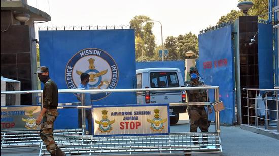 Security personnel stand guard outside Jammu Airforce Station. (ANI) Security personnel stand guard outside Jammu Airforce Station. (ANI)