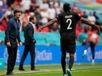 Germany coach Joachim Low gives instructions to Antonio Rudiger