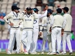 India's captain Virat Kohli, second left, and teammates celebrate(AP) India's captain Virat Kohli, second left, and teammates celebrate(AP)