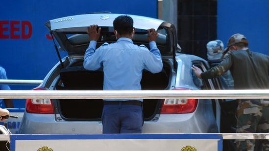 Security personnel inspect a vehicle outside Indian Air Force (IAF) station, in Jammu on June 29, 2021. (ANI Photo) Security personnel inspect a vehicle outside Indian Air Force (IAF) station, in Jammu on June 29, 2021. (ANI Photo)