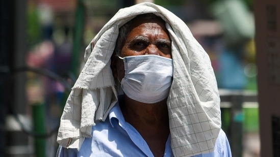 A man covers his head with a cloth to protect himself from heat on a hot afternoon in New Delhi on June 29. Mahesh Palawat, vice-president (climate change and meteorology) at Skymet Weather, a private weather forecaster, said the reason behind such high temperatures in Delhi was the dry westerly winds blowing over the national capital. (ANI) A man covers his head with a cloth to protect himself from heat on a hot afternoon in New Delhi on June 29. Mahesh Palawat, vice-president (climate change and meteorology) at Skymet Weather, a private weather forecaster, said the reason behind such high temperatures in Delhi was the dry westerly winds blowing over the national capital. (ANI)