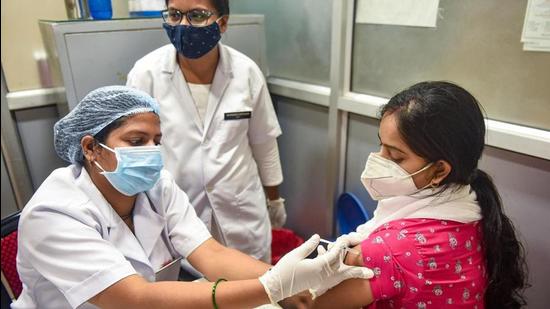 A health worker administers Covid-19 vaccine to a woman in Lucknow. (PTI FILE PHOTO) A health worker administers Covid-19 vaccine to a woman in Lucknow. (PTI FILE PHOTO)