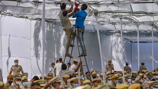 Workers fixing a tent during an official function at New Police Lines in New Delhi on June 30. Delhi appeared to be headed for an early monsoon this year, with IMD initially predicting its arrival on June 15, at least 12 days ahead of its usual arrival date of arrival on June 27. However, weather conditions changed since then and in subsequent forecasts, IMD officials said that the monsoon in Delhi was on “halt” and was unlikely to hit the region till at least the first week of July. (Ravi Choudhary / PTI) Workers fixing a tent during an official function at New Police Lines in New Delhi on June 30. Delhi appeared to be headed for an early monsoon this year, with IMD initially predicting its arrival on June 15, at least 12 days ahead of its usual arrival date of arrival on June 27. However, weather conditions changed since then and in subsequent forecasts, IMD officials said that the monsoon in Delhi was on “halt” and was unlikely to hit the region till at least the first week of July. (Ravi Choudhary / PTI)