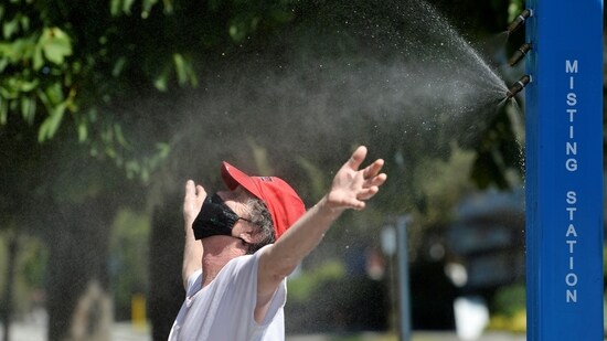 A man cools off at a misting station during the scorching weather of a heatwave in Vancouver, British Columbia, Canada on June 27 (Jennifer Gauthier / REUTERS)