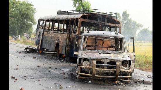 Police vehicles were burnt during the protest following firing by cops on agitators in Kotakapura and Behbal Kalan in October 2015. (Sanjeev Kumar/HT)