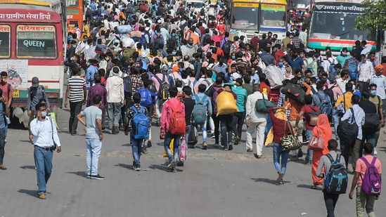 Shortly after the nationwide lockdown was imposed in 2020, hundreds of thousands of migrants spilled out on the to the highways, walking and cycling hundreds of kilometres back to their homes in the hinterlands. (PTI file photo ) Shortly after the nationwide lockdown was imposed in 2020, hundreds of thousands of migrants spilled out on the to the highways, walking and cycling hundreds of kilometres back to their homes in the hinterlands. (PTI file photo )