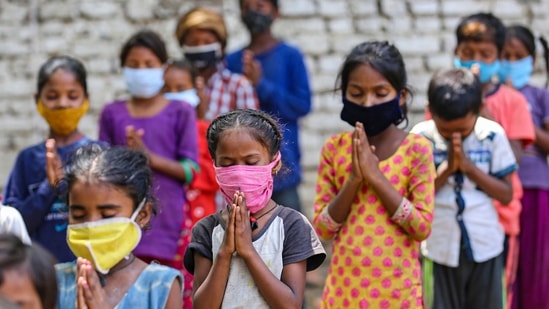 Children of slum dwellers attend class organised by social activist Kanchan Sharma during relaxation hours of Covid-19 lockdown, in a locality in Jammu, Thursday, June 17, 2021. (PTI) Children of slum dwellers attend class organised by social activist Kanchan Sharma during relaxation hours of Covid-19 lockdown, in a locality in Jammu, Thursday, June 17, 2021. (PTI)