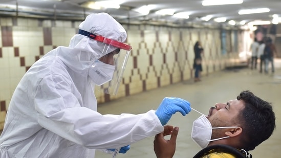 A health workers conducting a Covid-19 test (PTI)