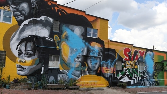 Blue pant covers over parts of the “Say Their Names” mural in Louisville, Ky., on Monday, June 28, 2021. Officials say the mural that depicts Breonna Taylor, George Floyd and other Black people recently killed by law enforcement has been defaced. (AP)