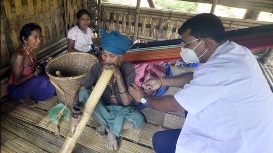 A Reang (Bru) woman gets her first dose of Covid-19 vaccine at Gobindabari village council under Chowmanu outskirt of Agartala. (File photo)