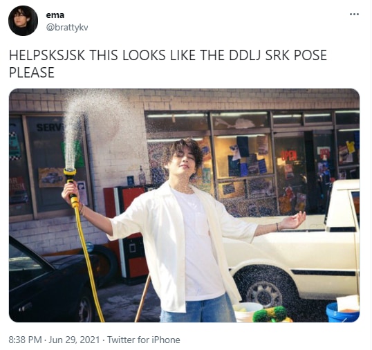V held a hose that splashed water all around him.