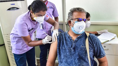 A medic administers a dose of Sputnik V vaccine to a beneficiary during its launch in Bengaluru. (PTI Photo) A medic administers a dose of Sputnik V vaccine to a beneficiary during its launch in Bengaluru. (PTI Photo)
