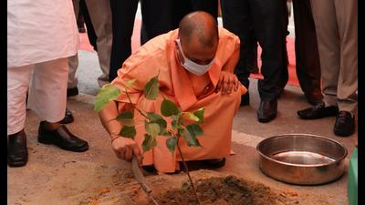Chief minister Yogi Adityanath planting a sapling to kick start ‘Van Mahotsav’ in UP . (Deepak Gupta/ht)