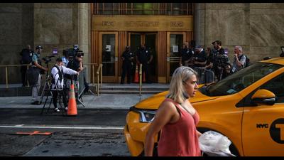 A woman walks past the Criminal Courts building and District Attorneys office in Manhattan, where long-serving chief financial officer of former president Donald Trump’s company, Allen Weisselberg is being held on Thursday. (AFP) A woman walks past the Criminal Courts building and District Attorneys office in Manhattan, where long-serving chief financial officer of former president Donald Trump’s company, Allen Weisselberg is being held on Thursday. (AFP)