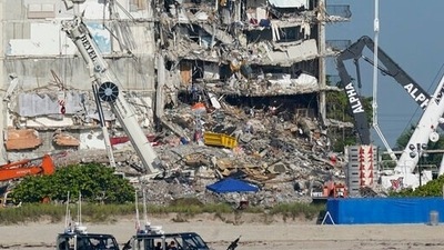 Rescue efforts at the site of the partially collapsed building were halted Thursday out of concern about the stability of the remaining structure. (AP)