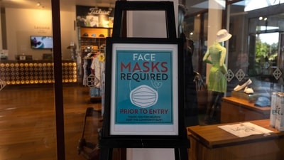 A sign reminding guests to wear protective masks displayed at a hotel in Phuket, Thailand. (Luke Duggleby/Bloomberg) A sign reminding guests to wear protective masks displayed at a hotel in Phuket, Thailand. (Luke Duggleby/Bloomberg)