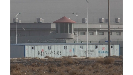 A guard tower and barbed wire fences are seen around a facility in the Kunshan Industrial Park in Artux in western China's Xinjiang region on December 3, 2018. This is one of a growing number of internment camps in the Xinjiang region, where by some estimates 1 million Muslims are detained, forced to give up their language and their religion and subject to political indoctrination.(Ng Han Guan / AP)