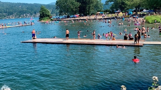 People flock to Bloedel Donovan park at Lake Whatcom in Bellingham, Wash., during an uncharacteristic Pacific Northwest heat wave.(AP) People flock to Bloedel Donovan park at Lake Whatcom in Bellingham, Wash., during an uncharacteristic Pacific Northwest heat wave.(AP)