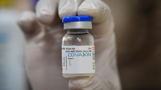 A health worker holding up a vial of Covaxin. (Sanchit Khanna / HT Photo) A health worker holding up a vial of Covaxin. (Sanchit Khanna / HT Photo)