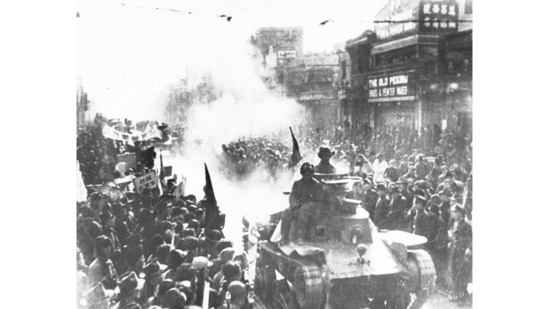 A column of Chinese Communist light tanks enter the streets of Beijing, formerly known as Peking, which are filled with people watching the conquerors pass on May 2, 1949. That year, Chiang Kai-shek's Nationalists lost the Chinese civil war to Mao Zedong's Communists and retreat from the Chinese mainland to the island of Taiwan.(AP Photo)