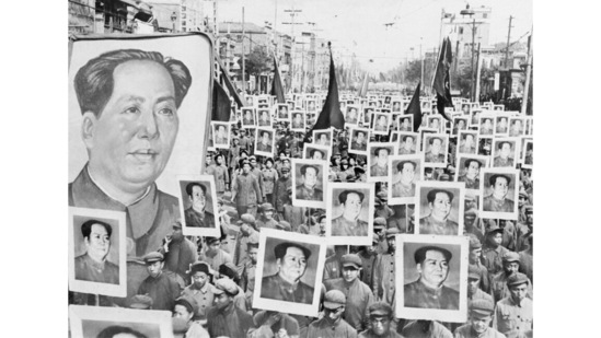 An undated photo shows crowds holding posters of China's Communist Party leader Mao Zedong filling the street of a city in China, celebrating the triumph of the Communist revolution.(AP Photo)